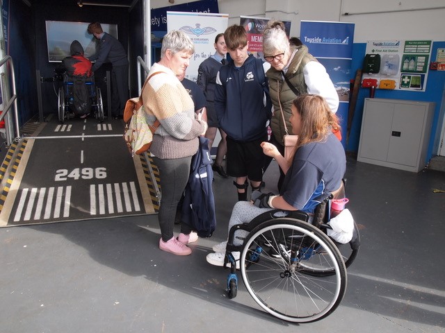 Wheelchair user and others by Mobile Flight Simulator.